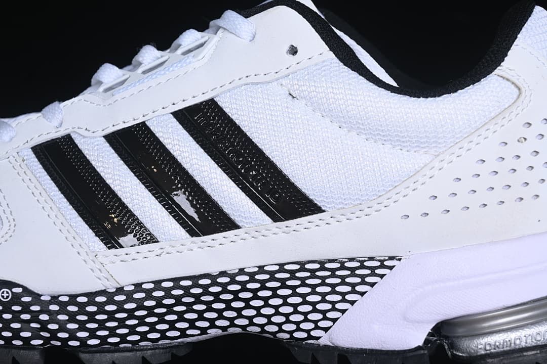 Close-up of black side stripes and dotted midsole detail