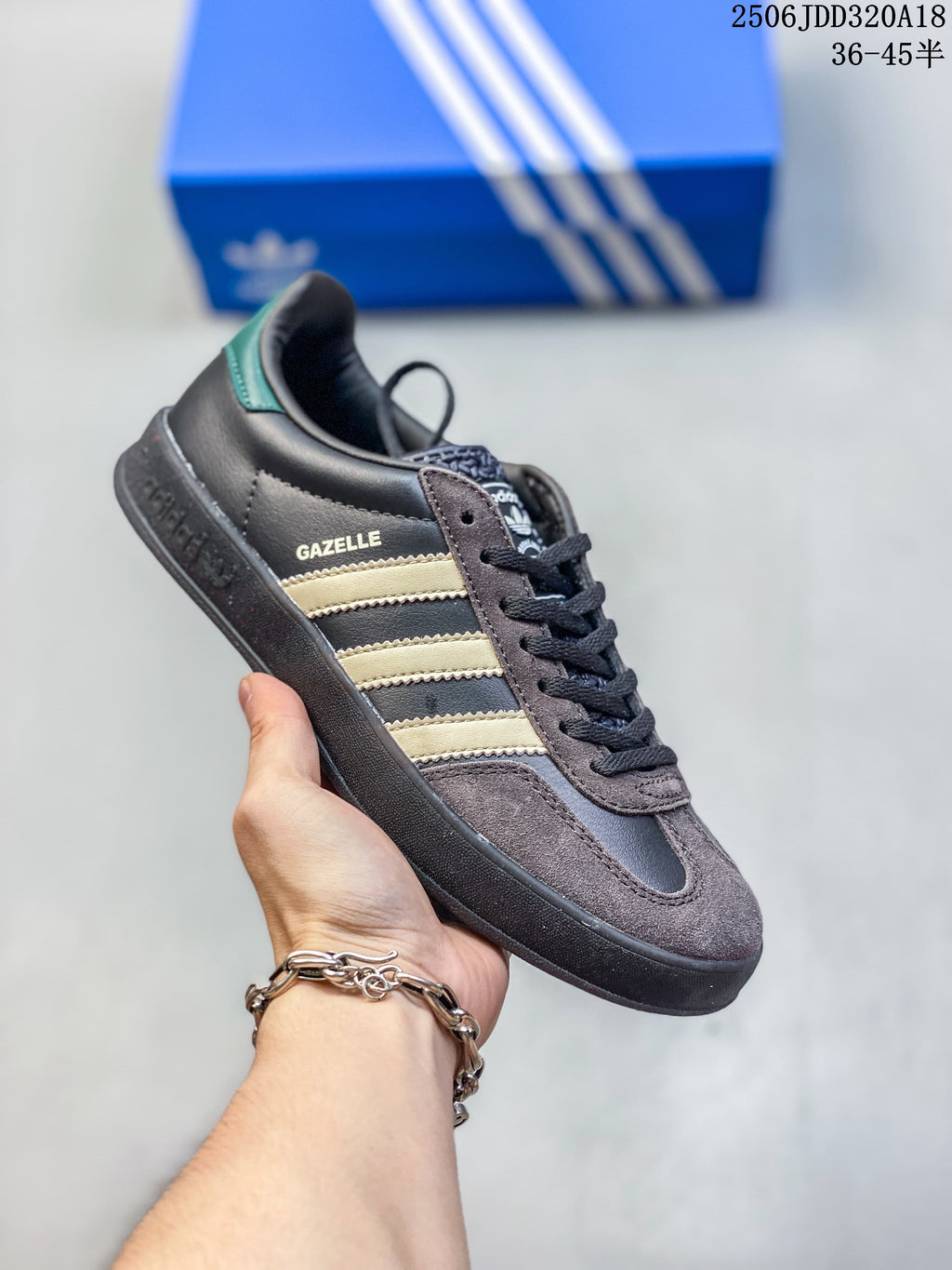 Charcoal Adidas Gazelle low-top sneaker with cream stripes and dark sole