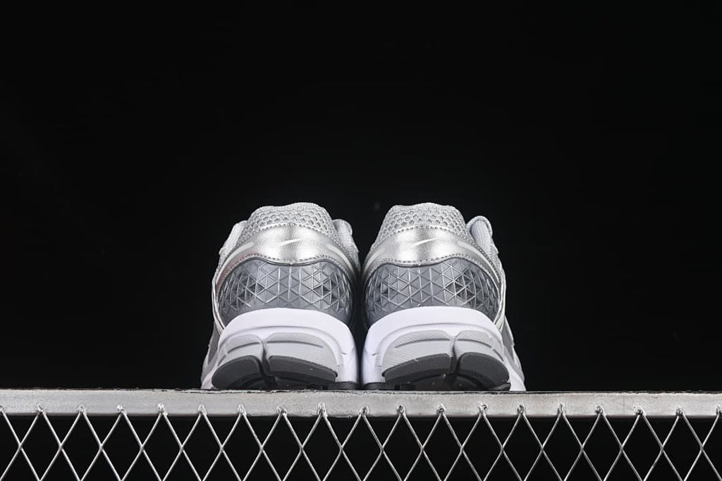 Rear view showing the heel panels and soles