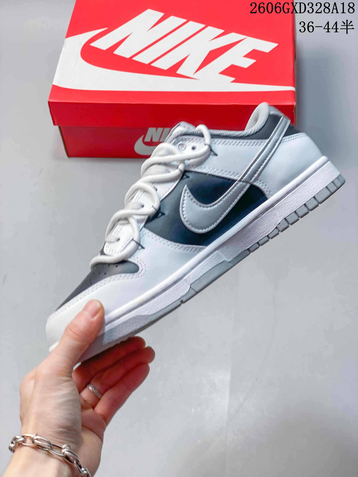 Side view highlighting the Swoosh detail and contrasting panels