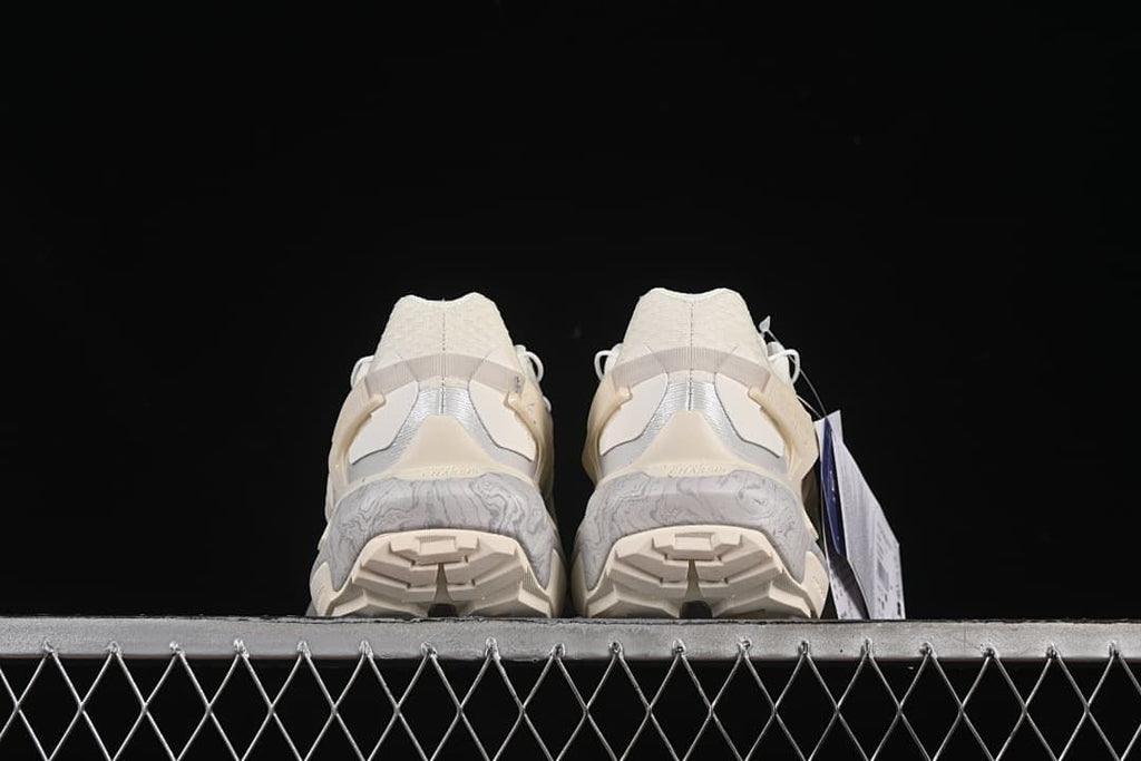 Rear view of both shoes showing the heel and outsole tread.