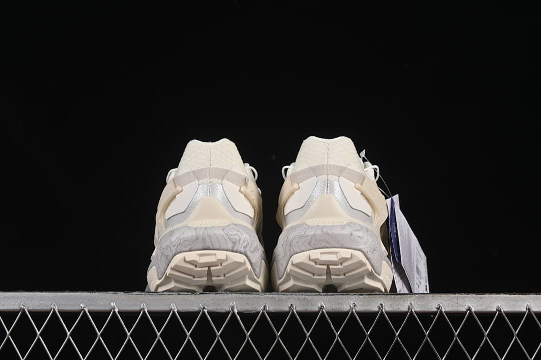 Rear view of both shoes showing the heel and outsole tread.