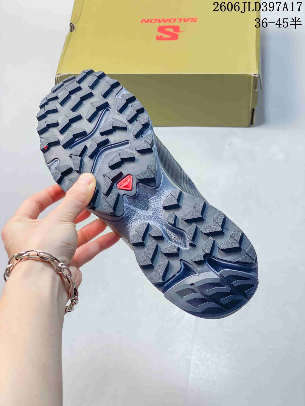 Close-up of the Salomon XT-4 OG outsole with prominent tread lugs