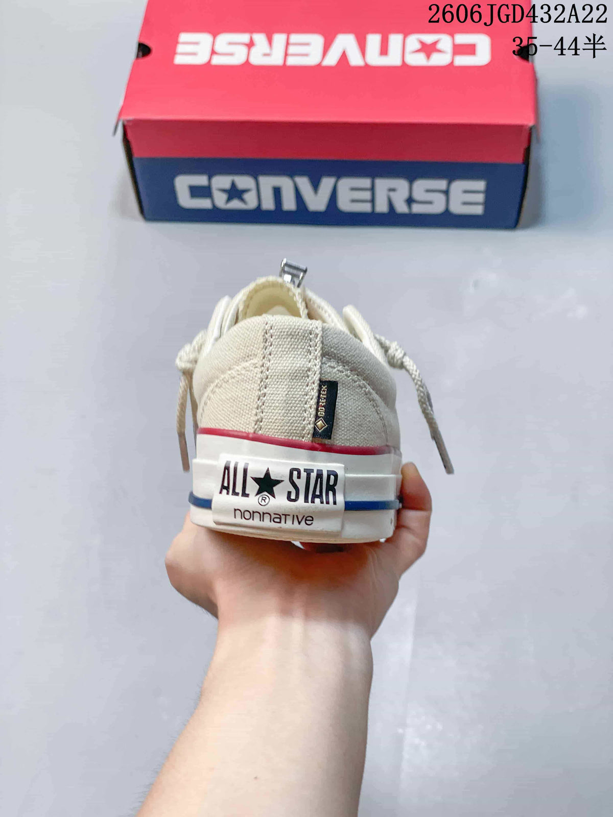 Rear view of the sneaker with All Star and nonnative heel lettering
