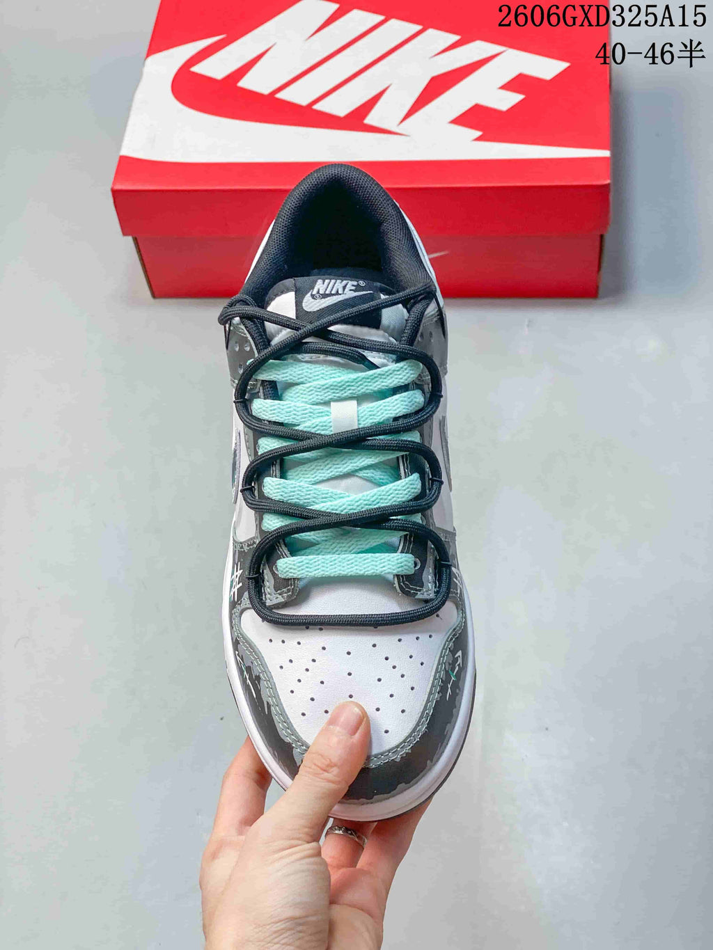 Top view showing the perforated toe and layered aqua and dark laces
