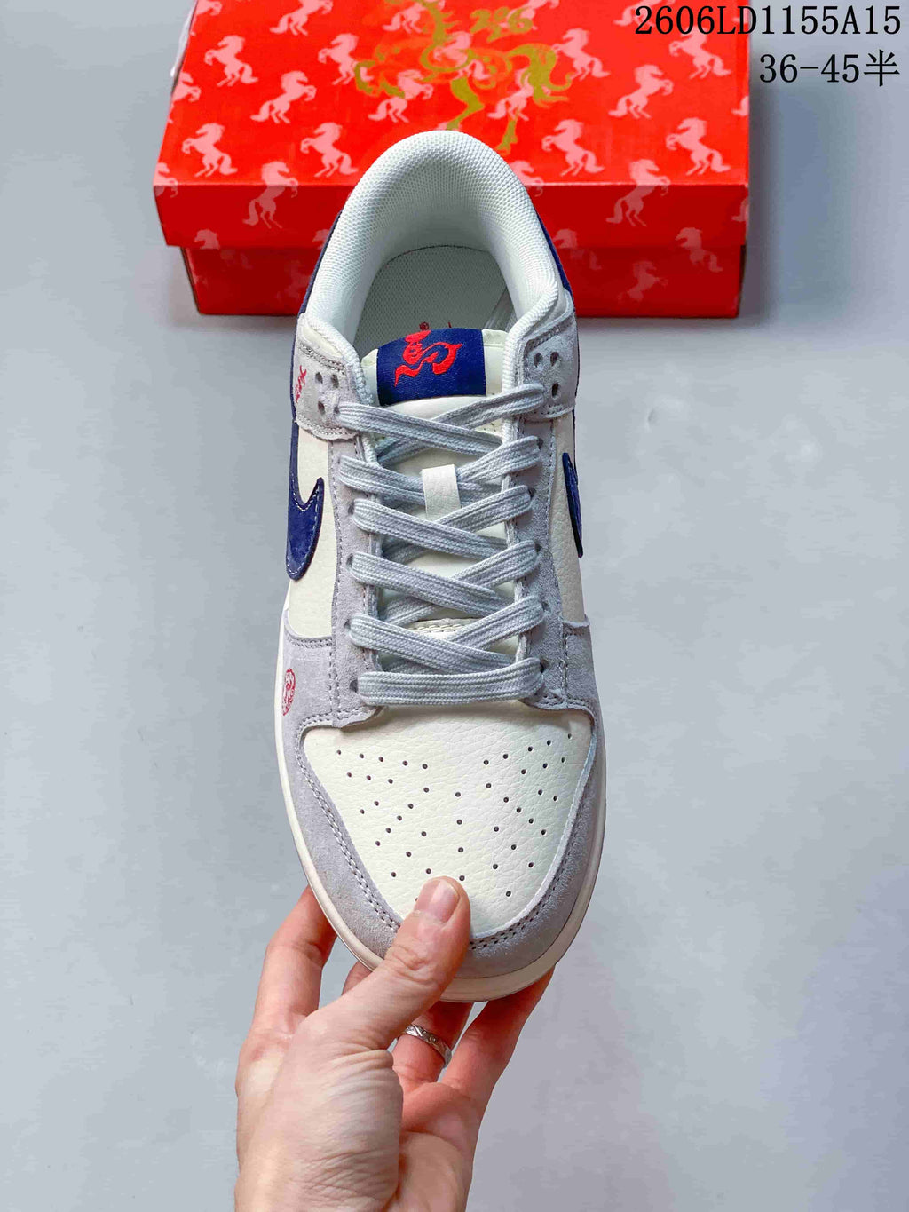 Top view showing the perforated toe, grey laces, and embroidered tongue detail
