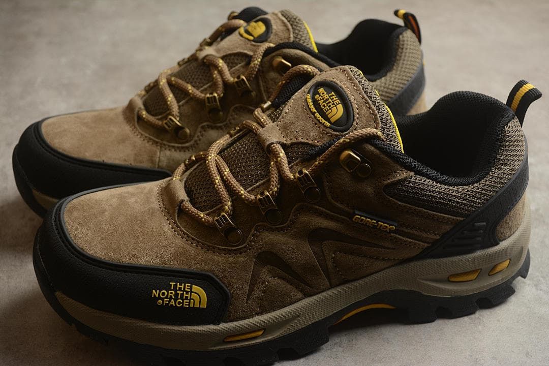 Pair of sand-colored low-cut outdoor shoes shown from above and the side