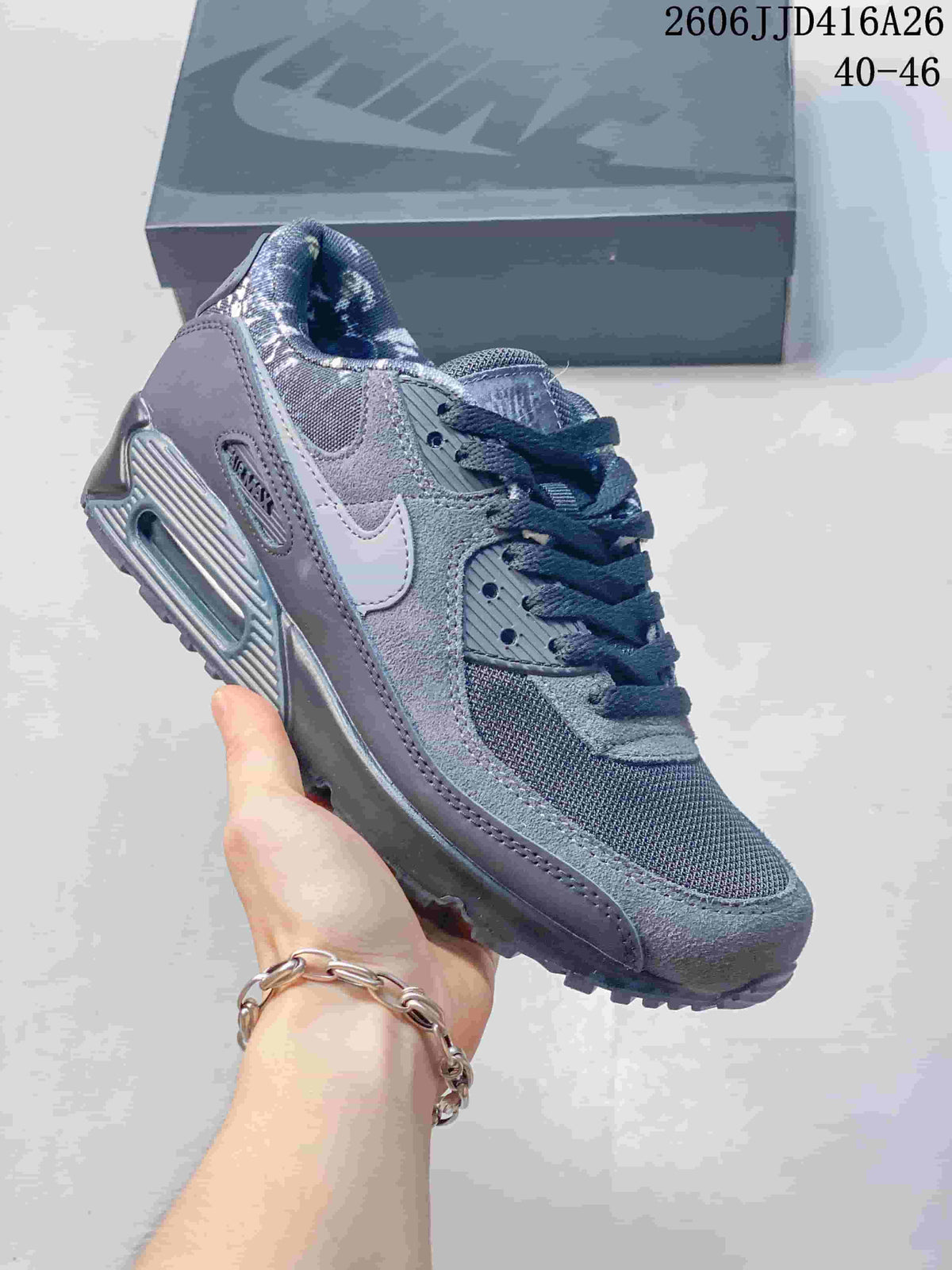 Dark gray Nike Air Max 90 sneaker with a white Swoosh and textured panels.