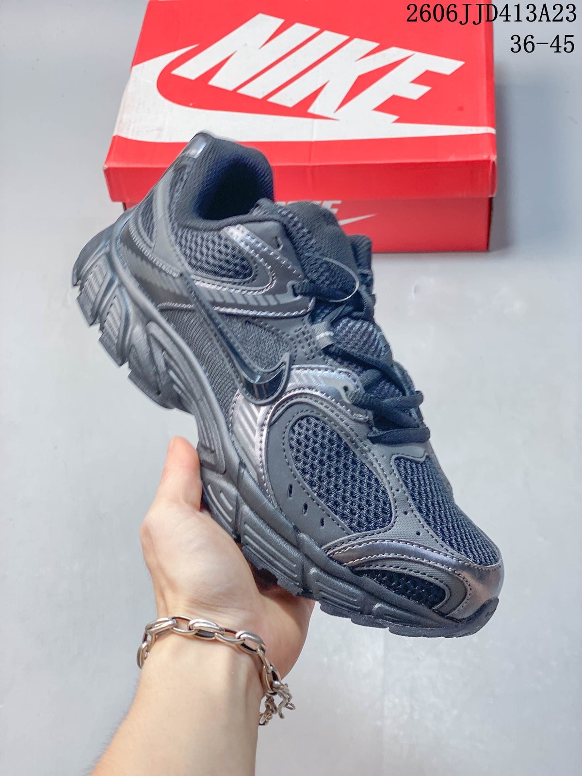 Angled side view of a dark charcoal Nike Air Zoom Winflo 12 shoe