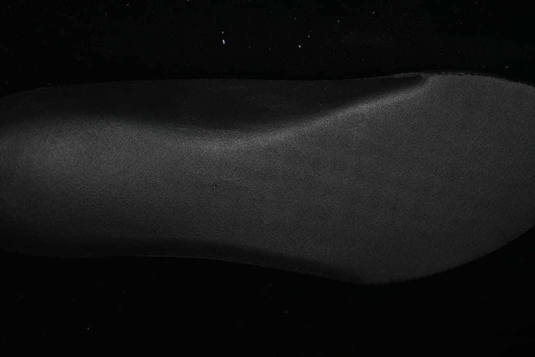 Close-up of the black textured outsole sidewall