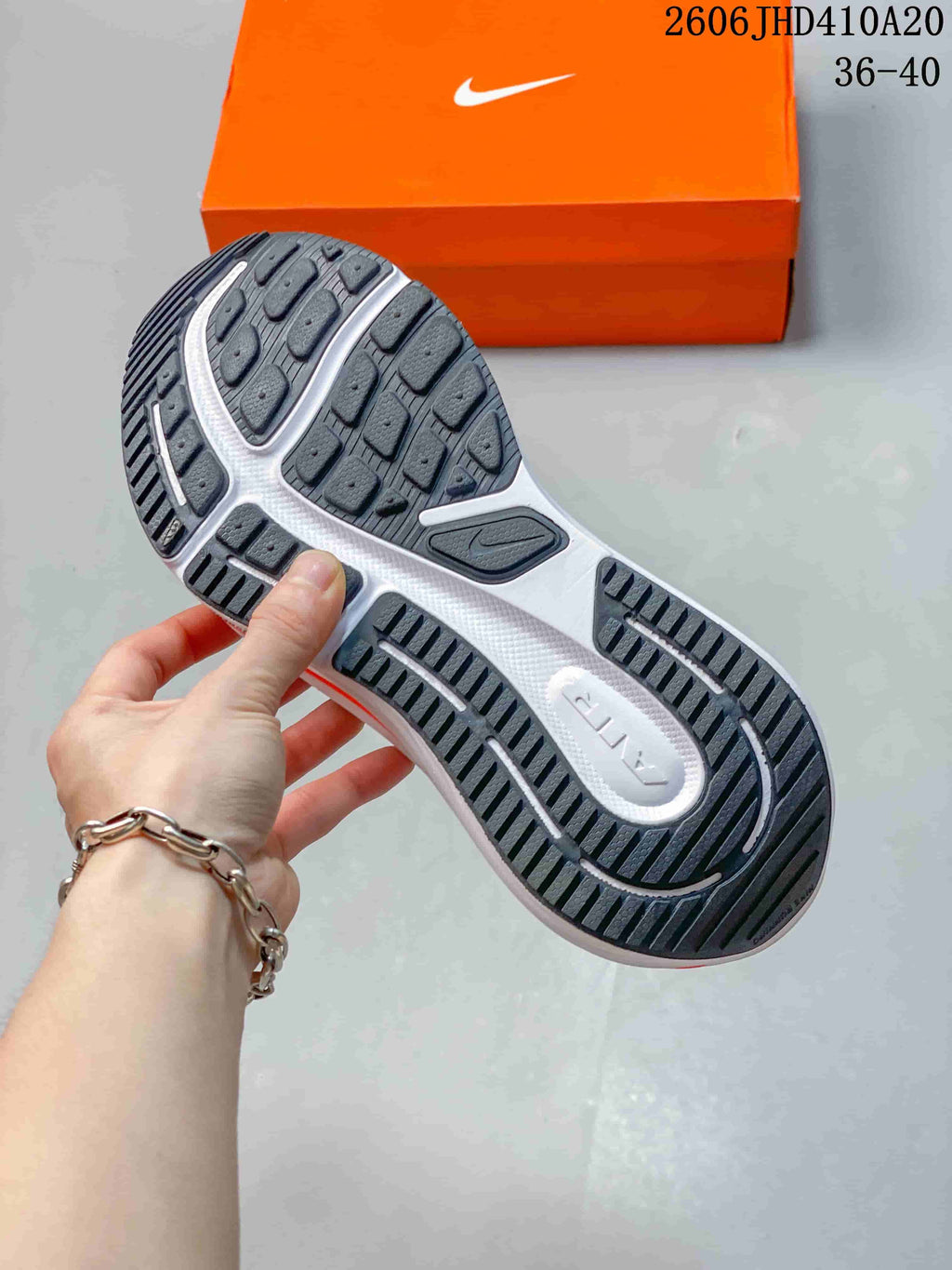 View of the dark treaded outsole on a Nike Air Zoom Winflo 12 shoe