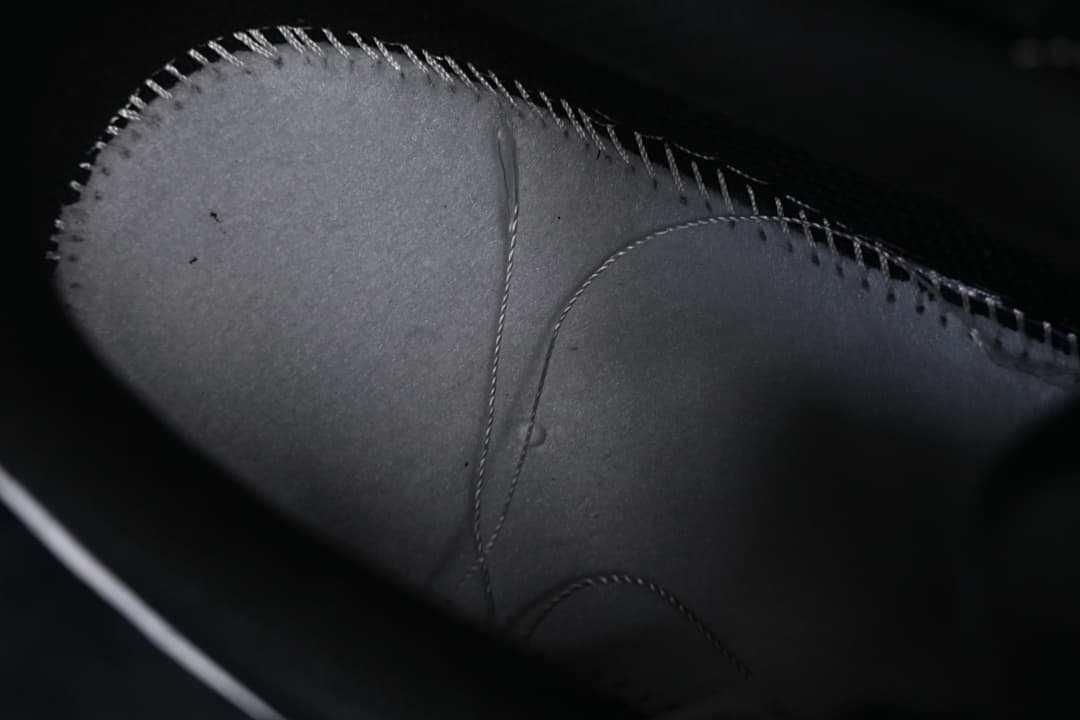 Close-up of stitched upper panel construction