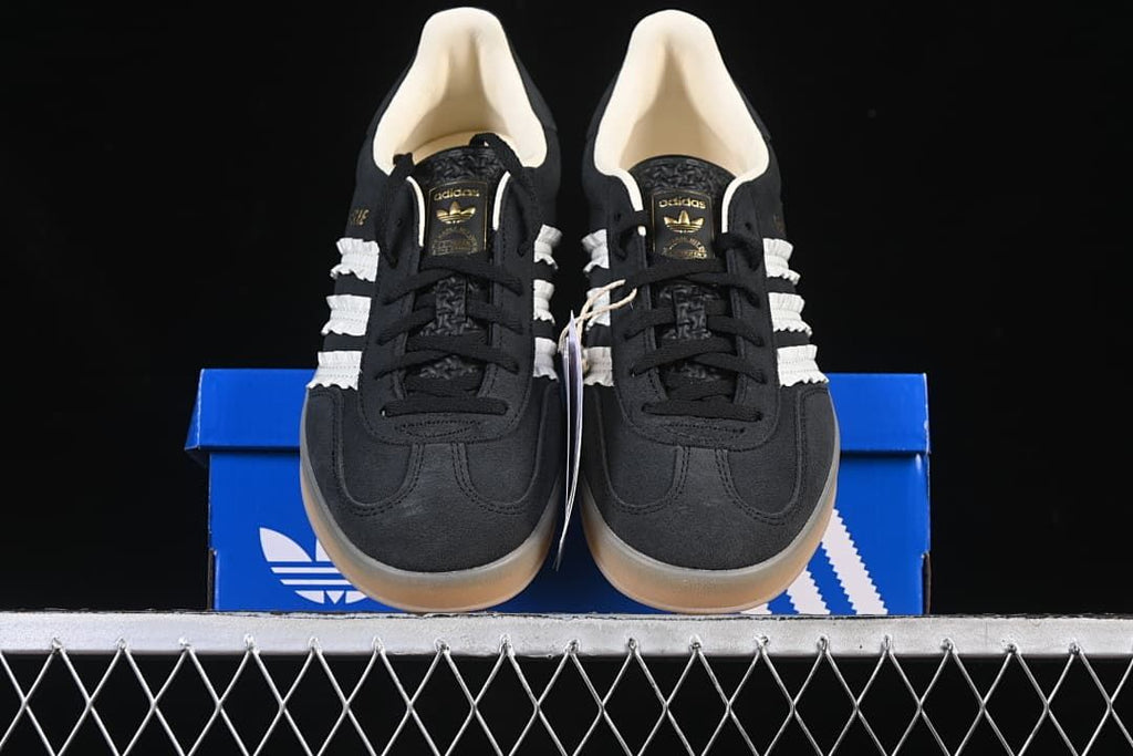Front view of the pair placed on a blue Adidas shoe box.
