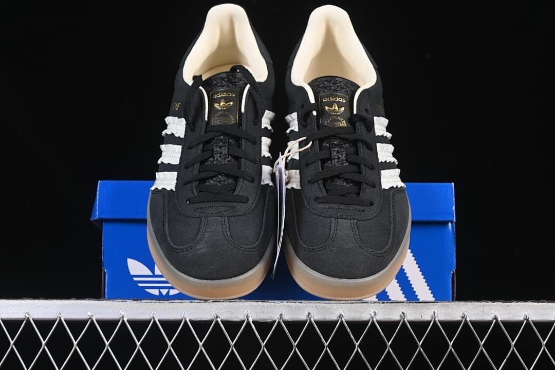 Front view of the pair placed on a blue Adidas shoe box.