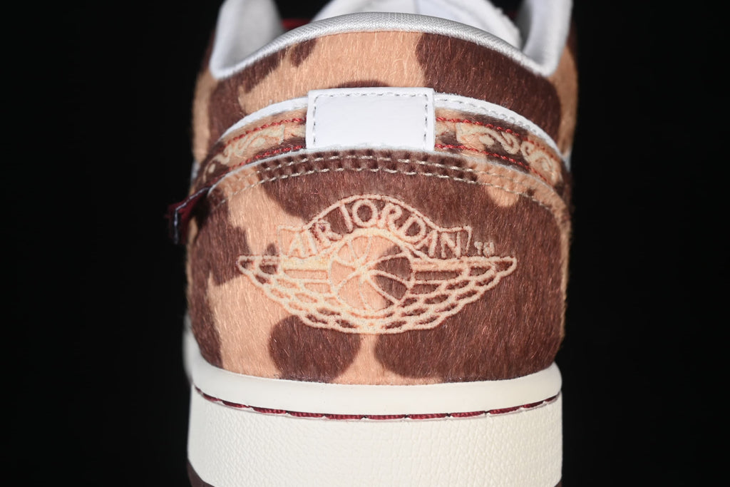 Close-up of the patterned heel panel and embroidered Jordan Wings emblem.