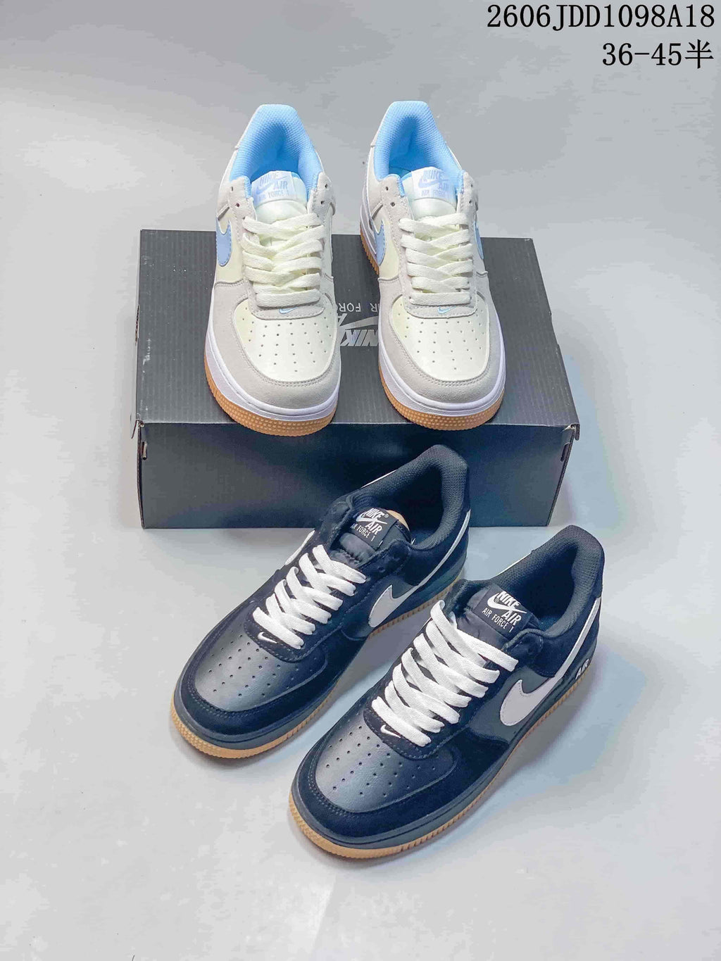 Light blue and white and navy and white low-top Air Force 1 pairs shown together.