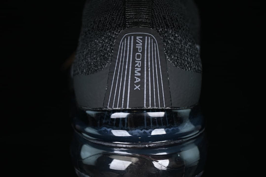 Rear close-up showing VaporMax heel branding and the visible sole