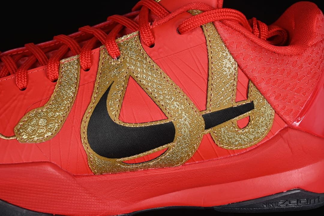 Close-up of the gold side graphic and black Swoosh