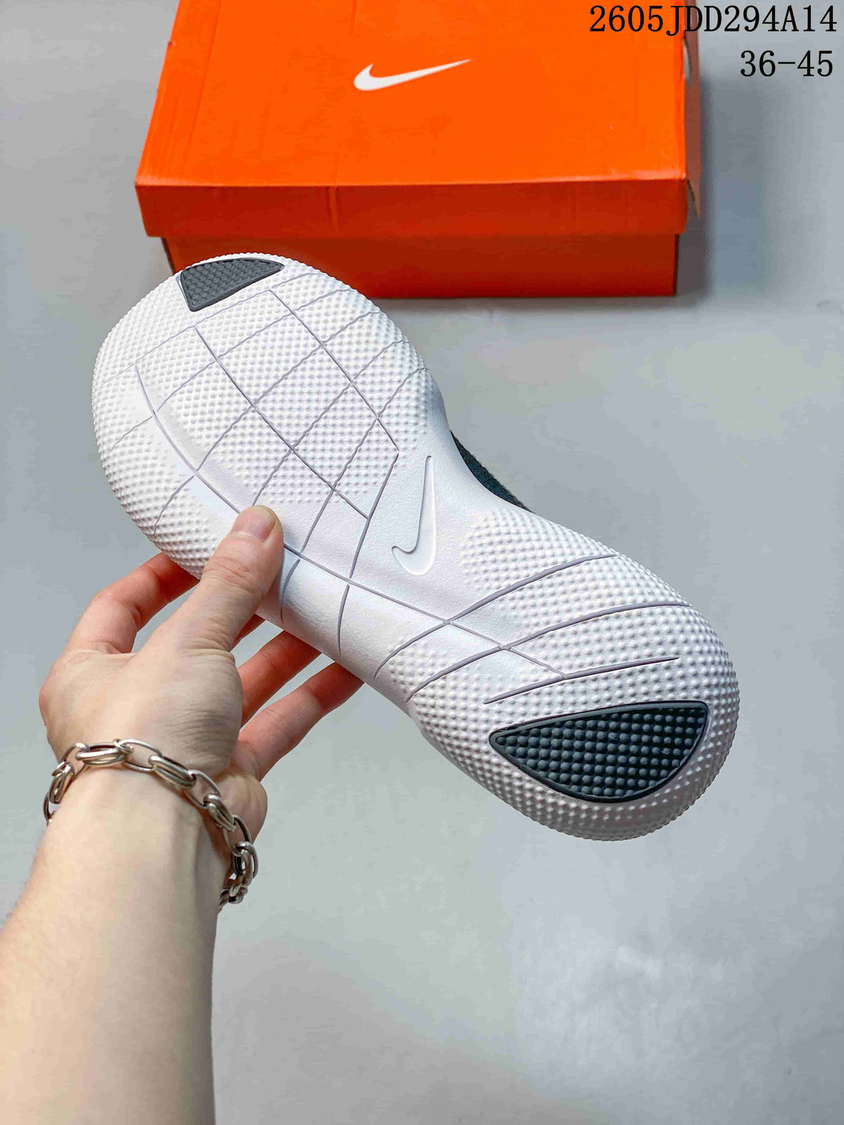 Underside of the white Nike Free sole showing grooves and textured sections