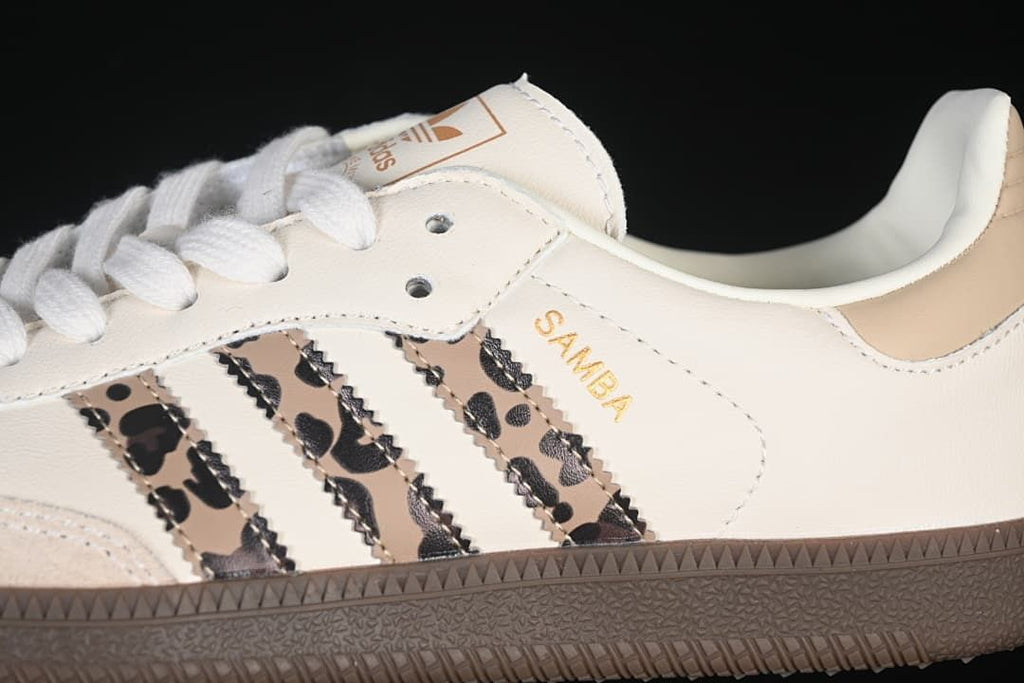 Close-up of leopard-patterned stripes, gold Samba text, and the textured brown sole