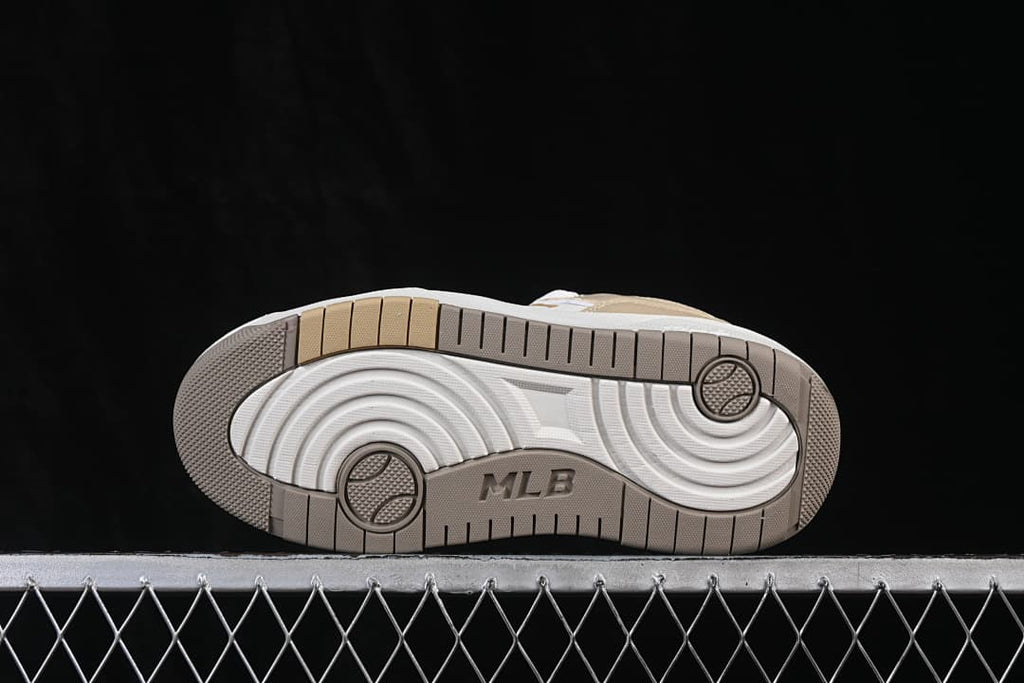 Underside view showing the patterned outsole and MLB lettering