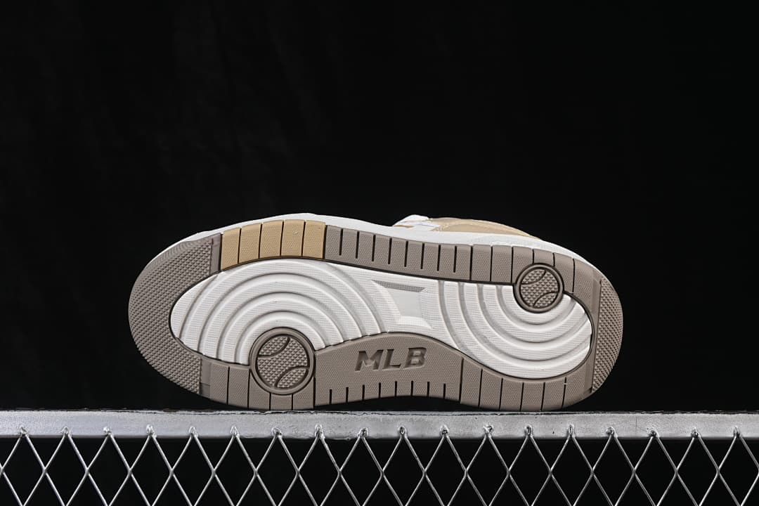 Underside view showing the patterned outsole and MLB lettering