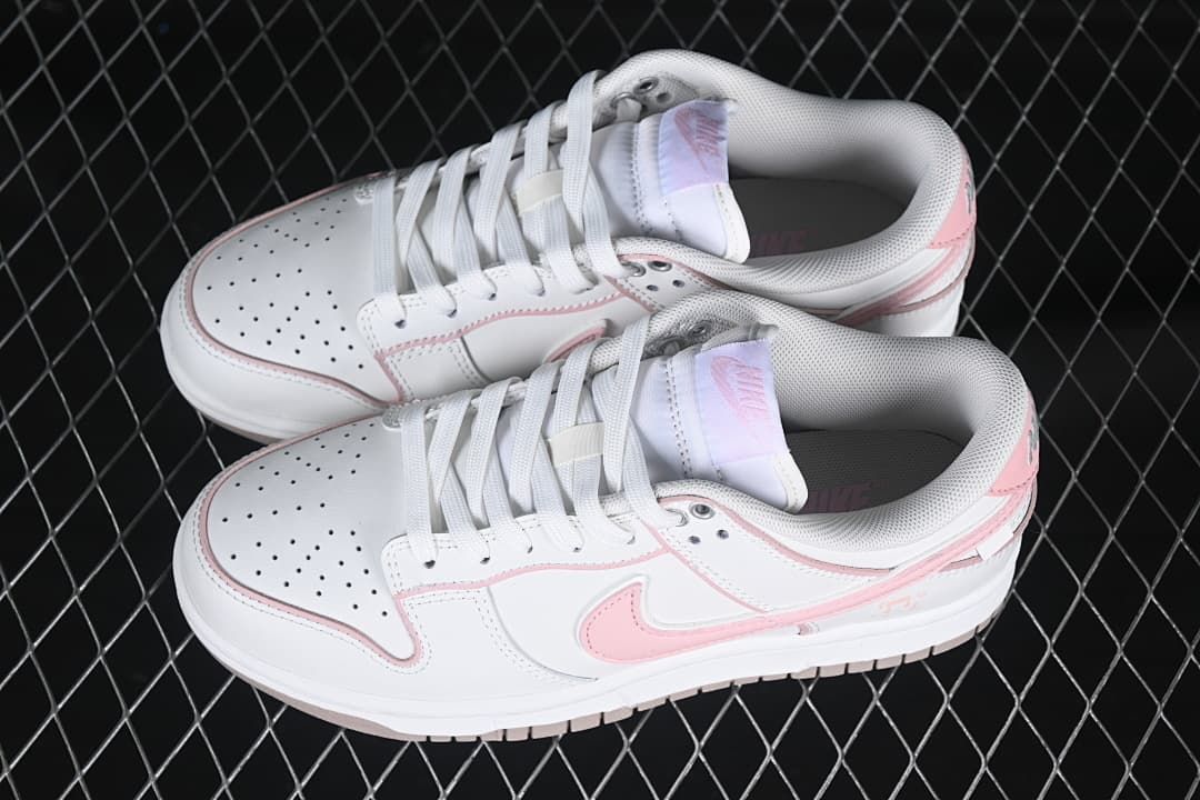Pair of white and pink low-top sneakers