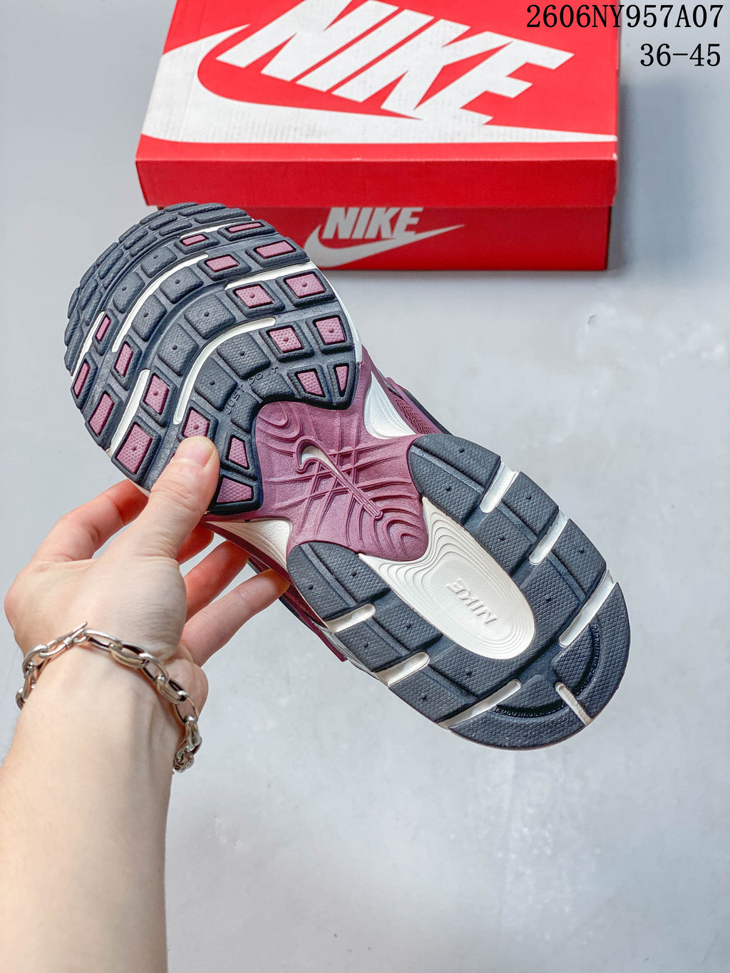 Underside of a Nike V5 RNR sneaker showing its patterned outsole.