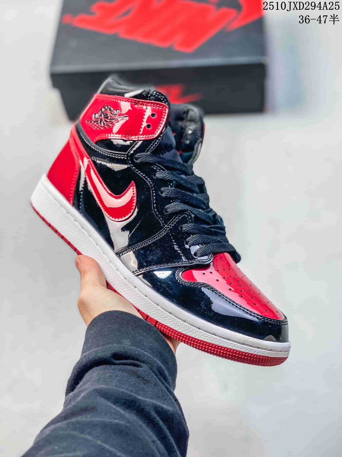Glossy black and red high-top sneaker with white midsole