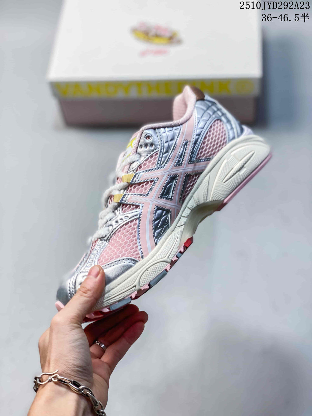 Side view of the pink and silver mesh sneaker