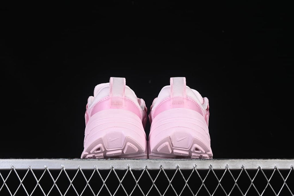 Rear view of both sneakers showing the heels and outsoles