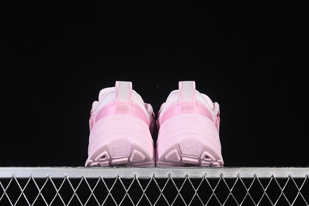 Rear view of both sneakers showing the heels and outsoles
