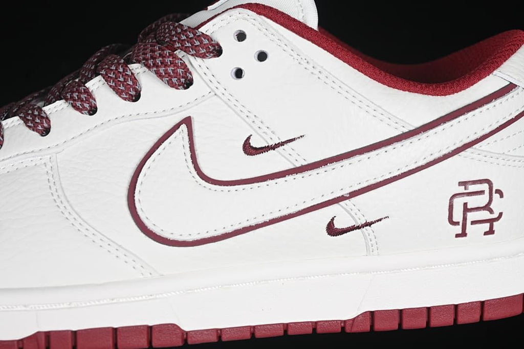 Close-up of layered side Swoosh and Reigning Champ heel emblem