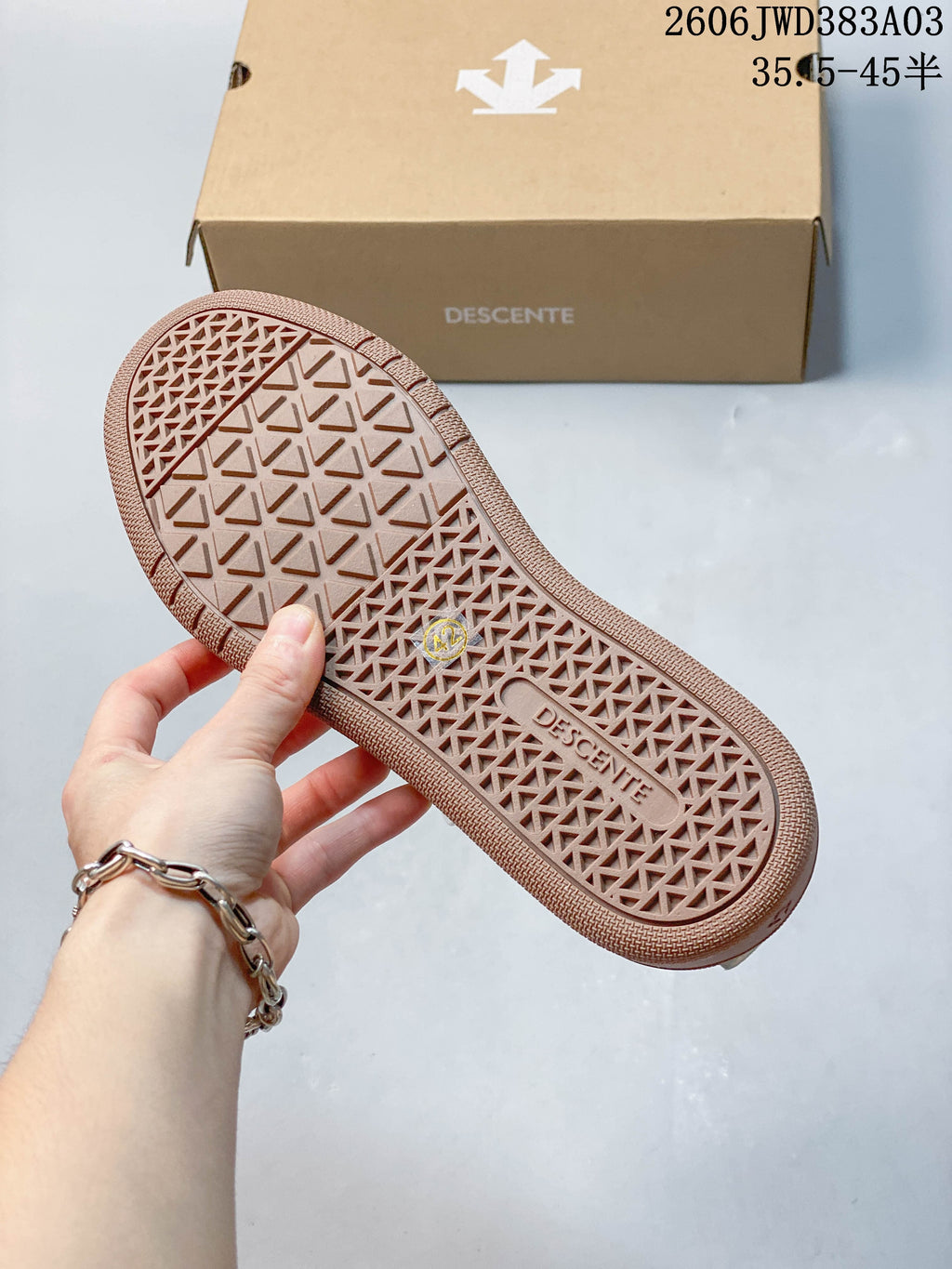 Gum-colored outsole with geometric tread pattern
