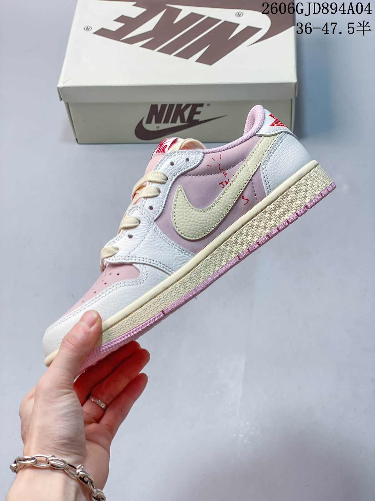 Side view of the pink and white low-top sneaker