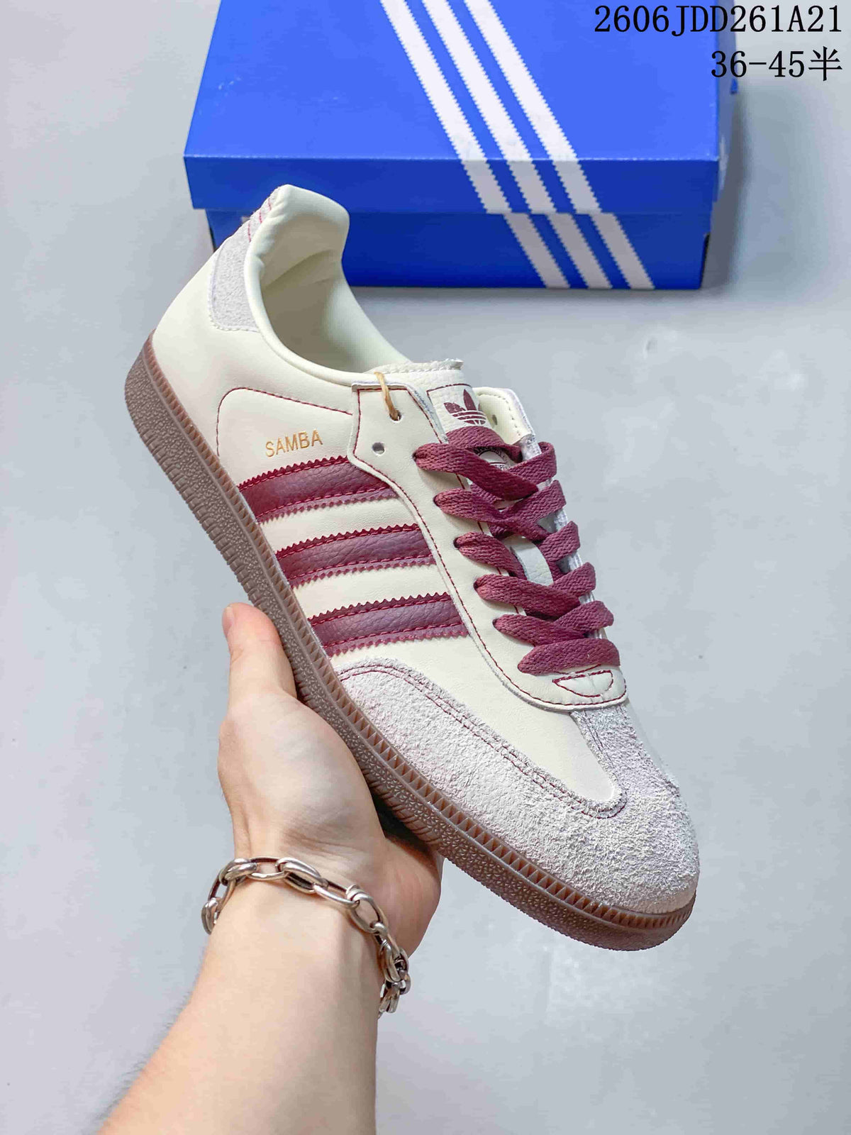 Close-up of a cream adidas Samba shoe with burgundy accents and a brown-toned sole.