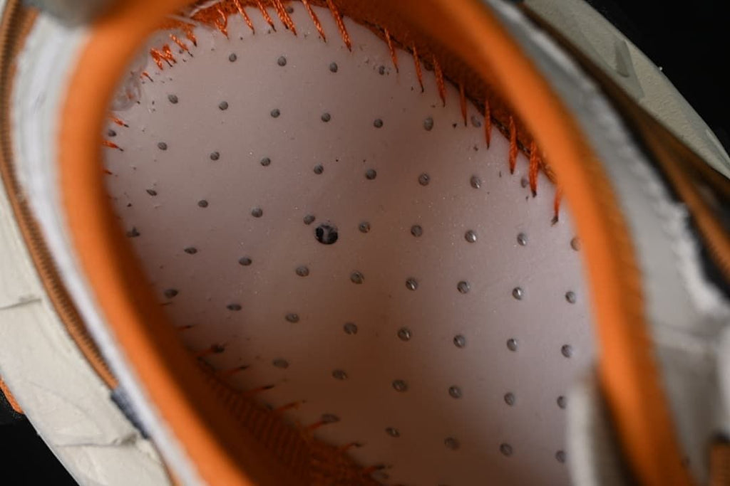Interior view showing the insole and orange lining
