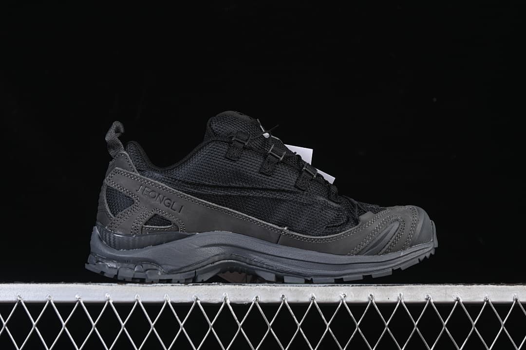 Side view showing the Jeong Li heel overlay and trail outsole