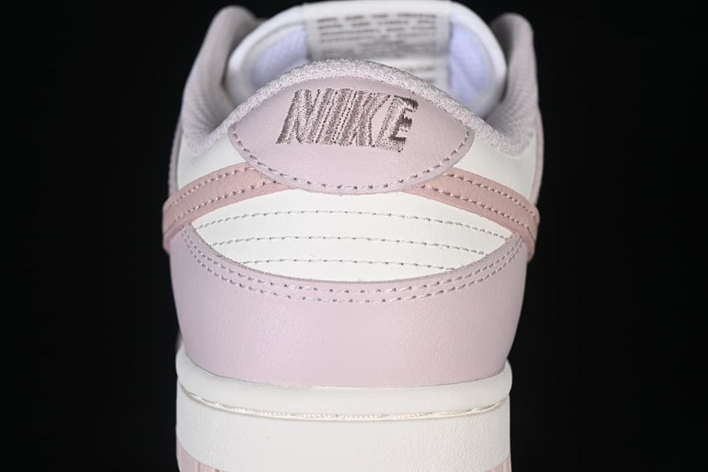 Rear view showing the pink heel and embroidered branding