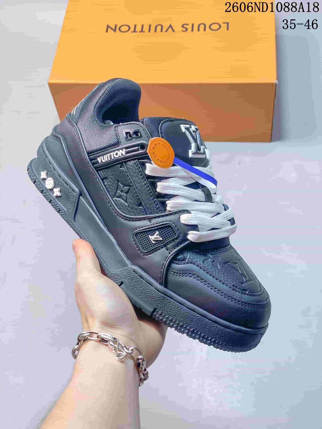 Angled view of a dark navy sneaker showing its side details, white laces, and textured sole