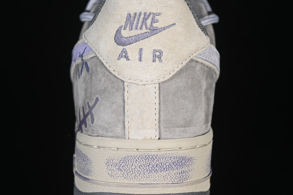 Close-up of the sneaker heel tab with Nike Air branding and hand-drawn markings