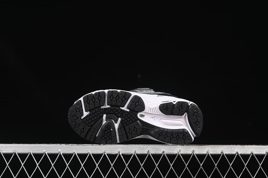 Underside view showing the dark segmented outsole