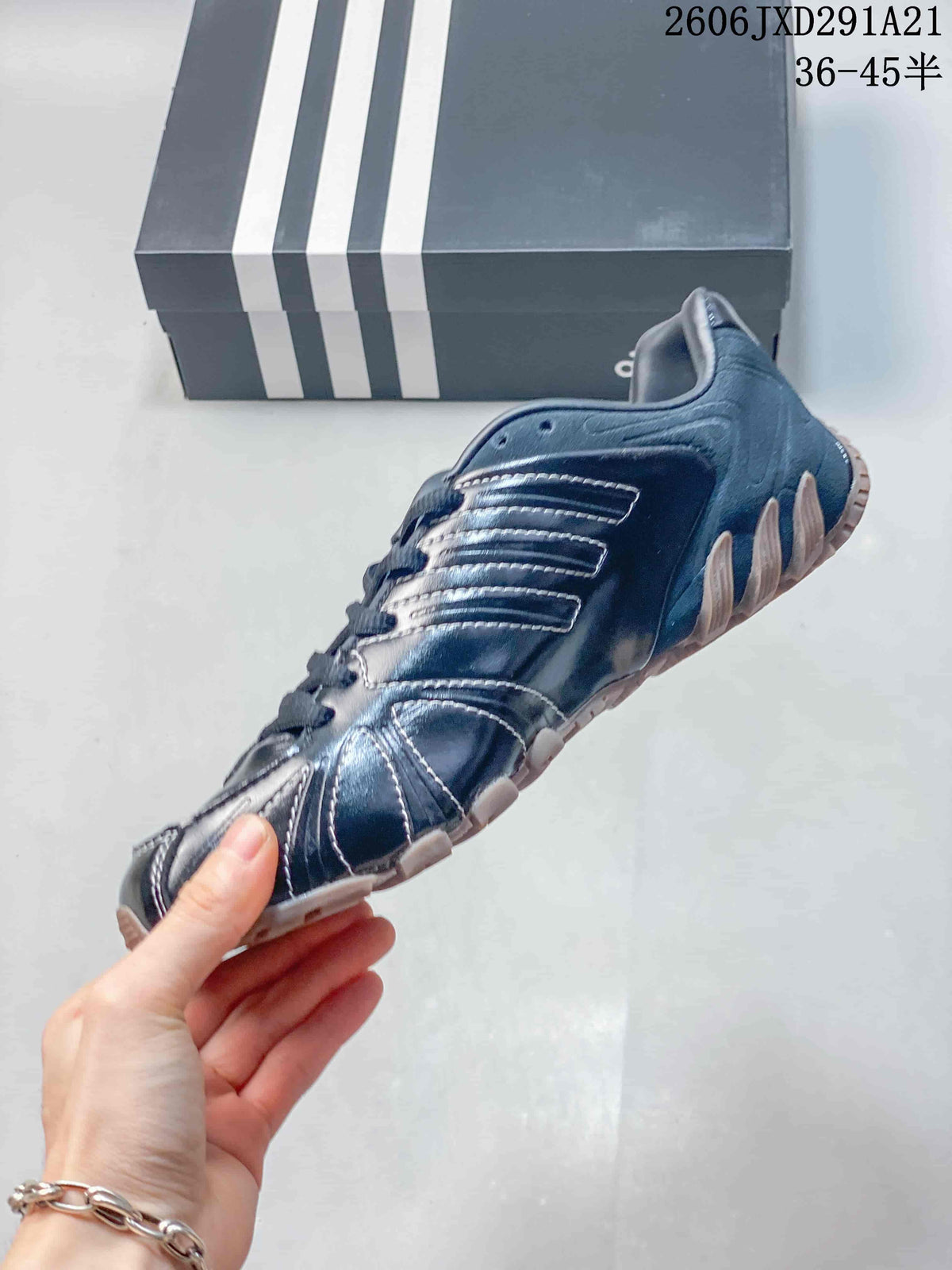 Side profile of a navy Ghost Sprint sneaker with stitched panels