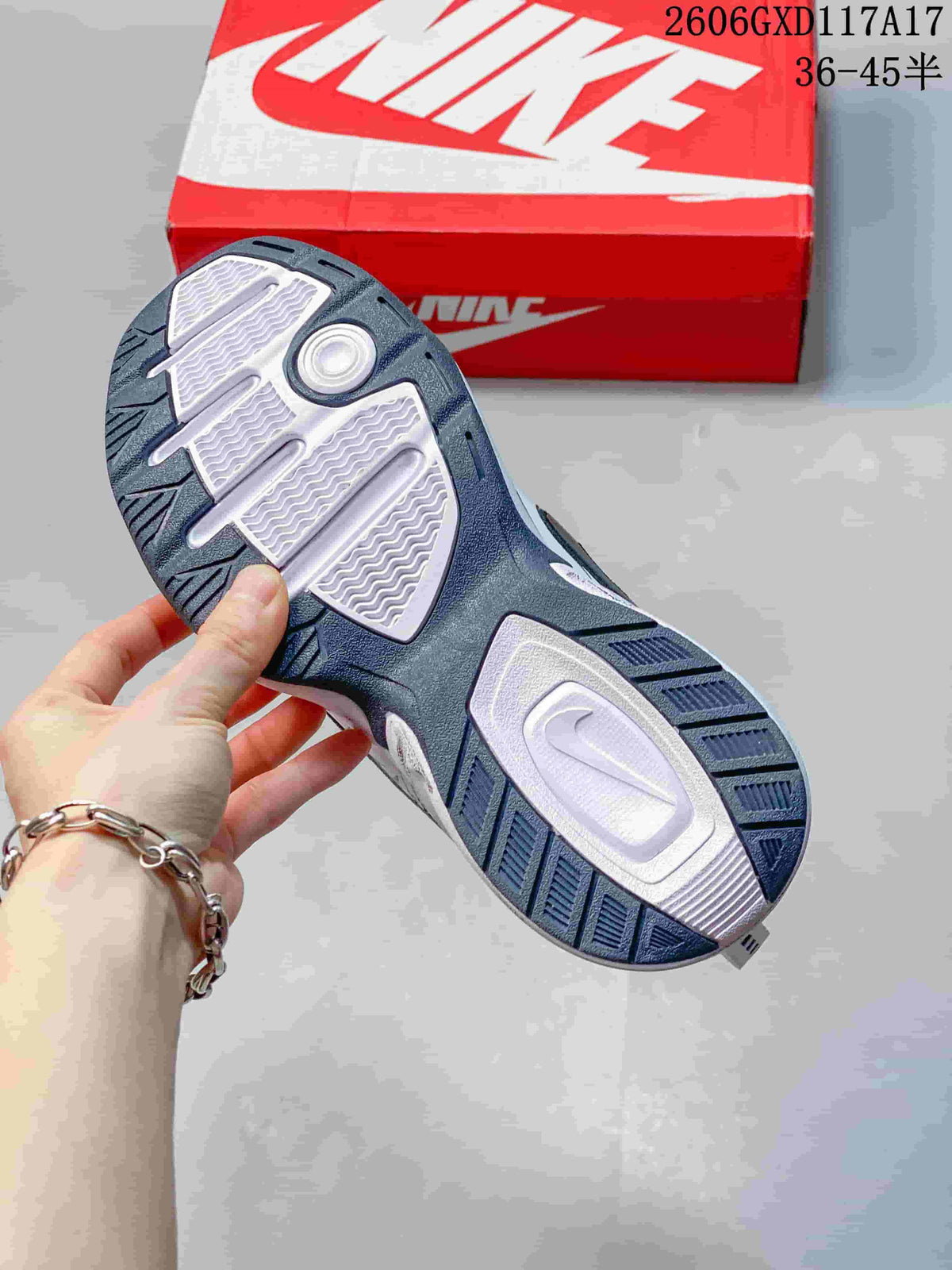 Close-up of the sneaker outsole with dark blue and light-colored sections