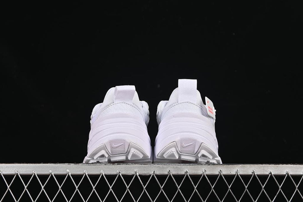 Rear view of both sneakers showing heel pulls and sole details.