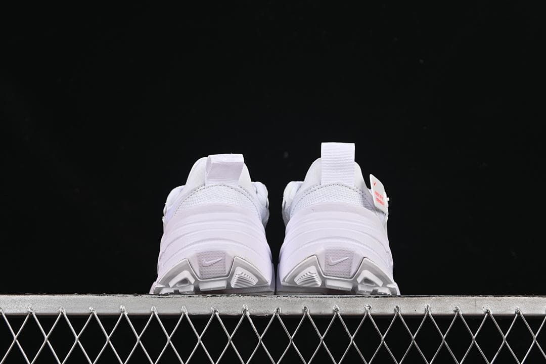 Rear view of both sneakers showing heel pulls and sole details.