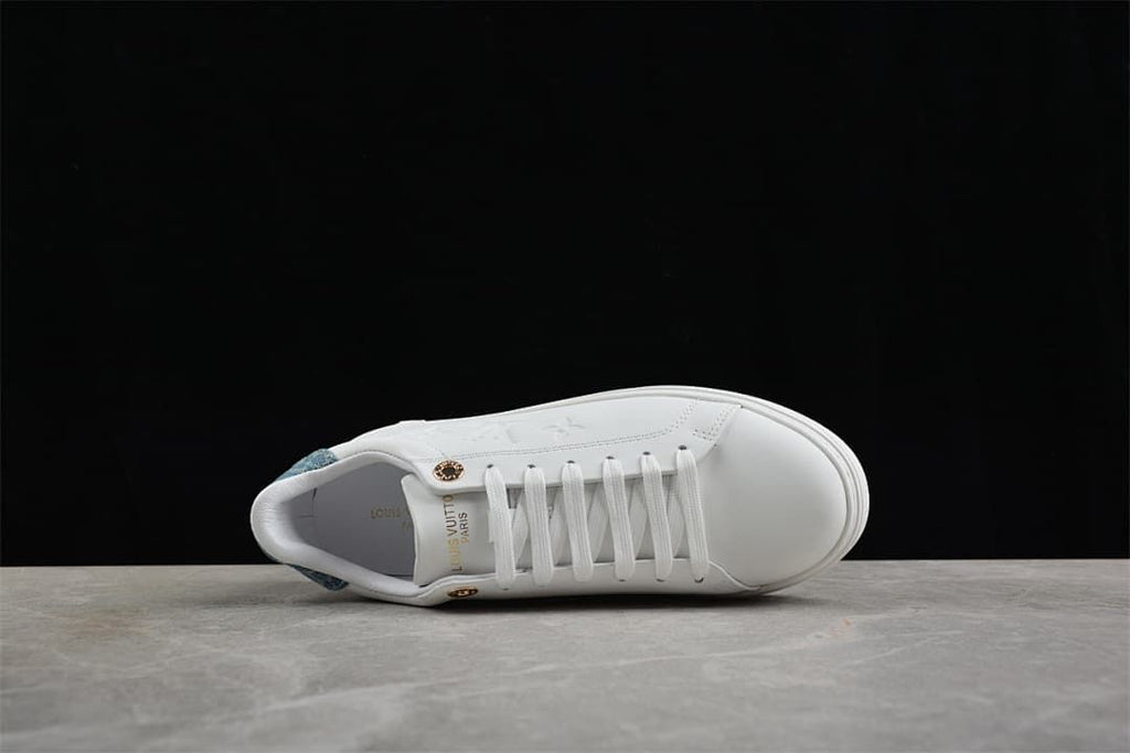 Top view of the white lace-up sneaker with blue heel detail