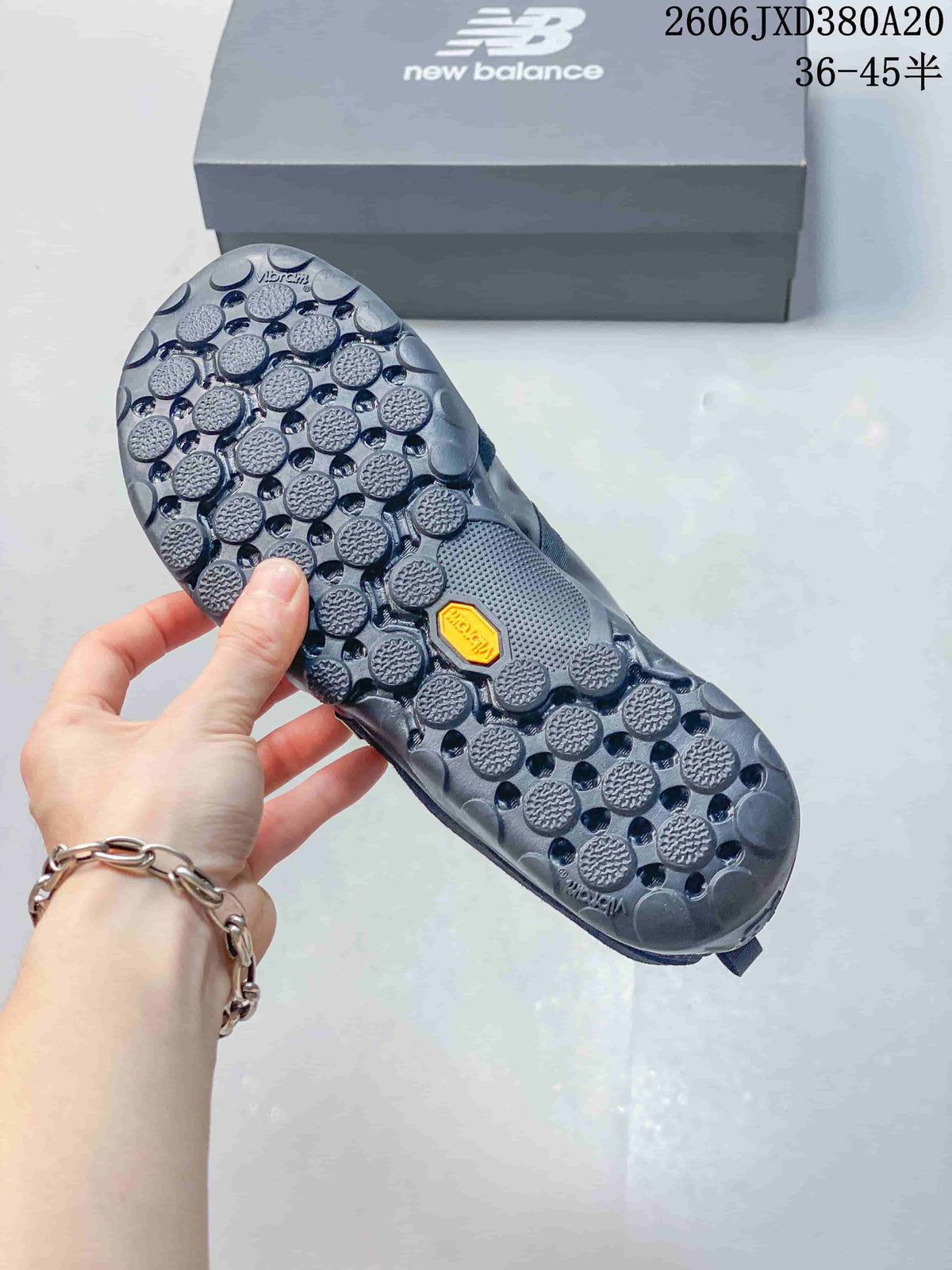 Close-up of the sneaker outsole with circular tread details
