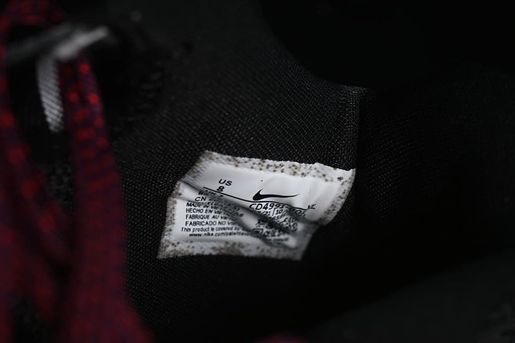 Close-up of black mesh lining and shoe label showing US 8