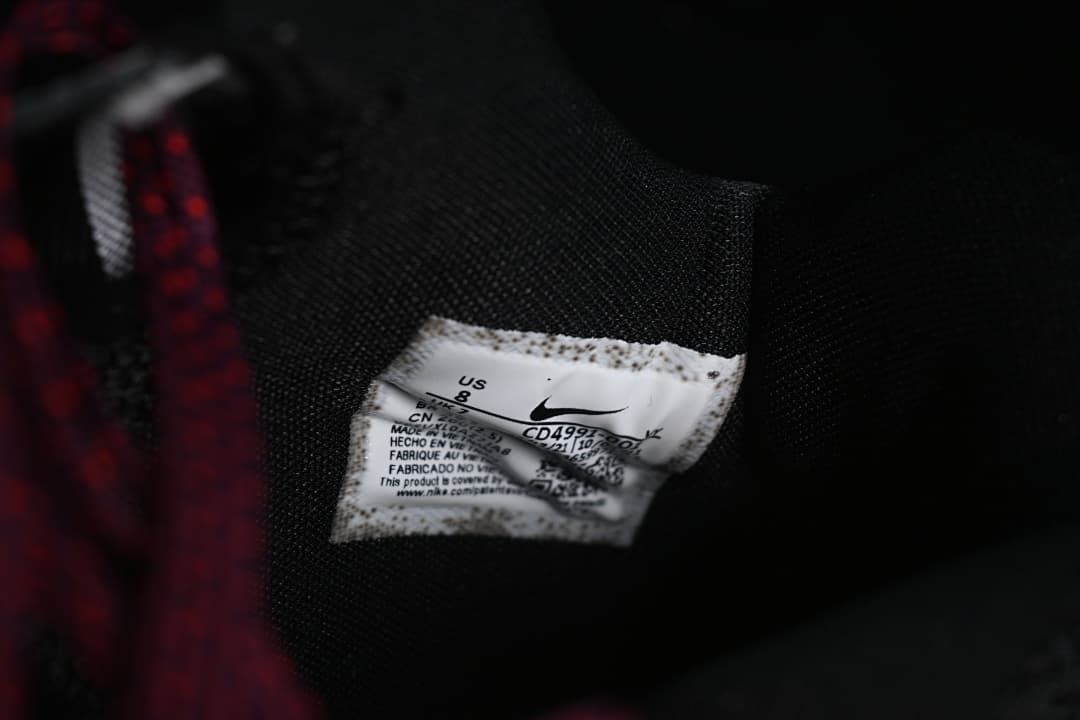 Close-up of black mesh lining and shoe label showing US 8